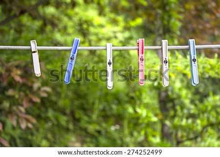 Many plastics clothes pin on washing line