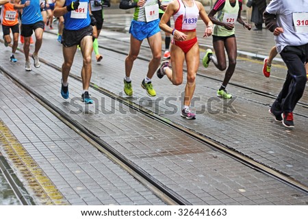 Unfocused Marathon running race in city streets