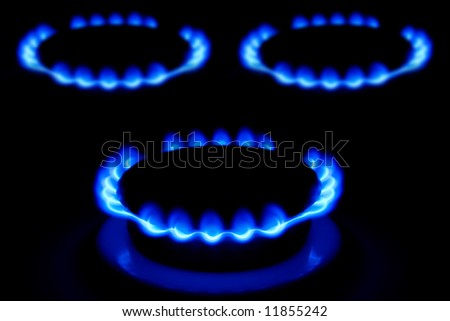 Dark blue flame of gas on a cooker