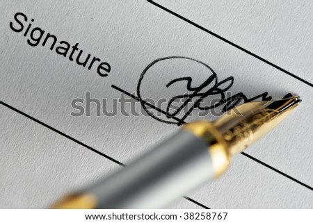 signature and pen close up