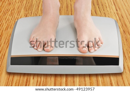 women legs on electronic scales