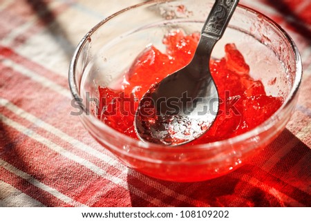 red jam in glass close up