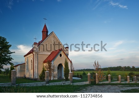 catholic church on green meadow