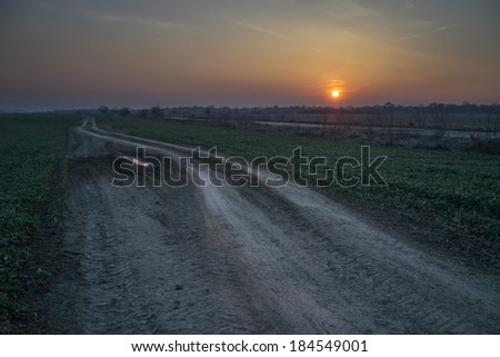 rural road and orange sunset