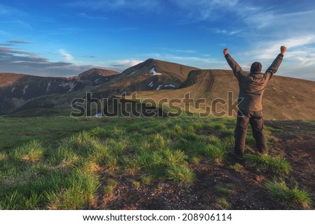 alone tourist on mountain top