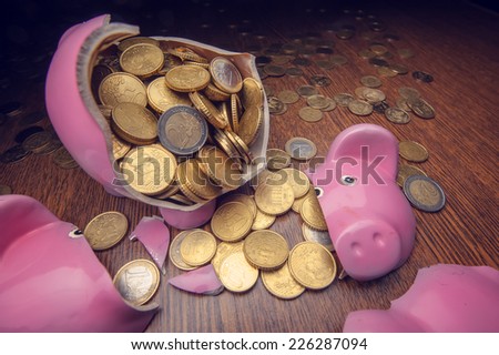 cracked pink pig moneybox closeup