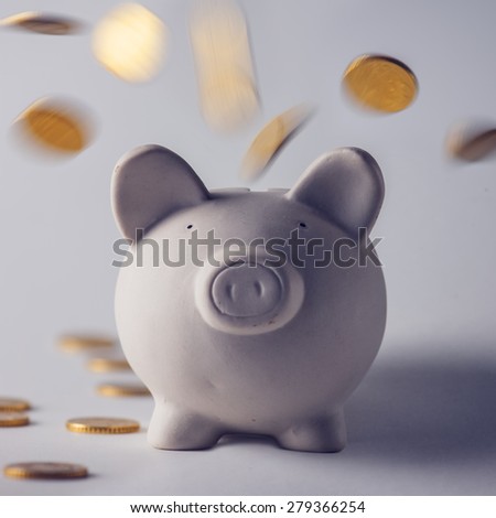 pig money box with golden coins