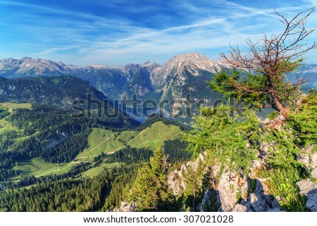 Beautiful view from top of cableway above the Konigsee lake on Schneibstein mountain ridge. Border of German and Austrian Alps, Europe.