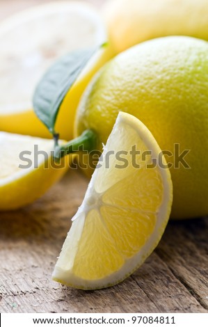 lemons on wood table closeup
