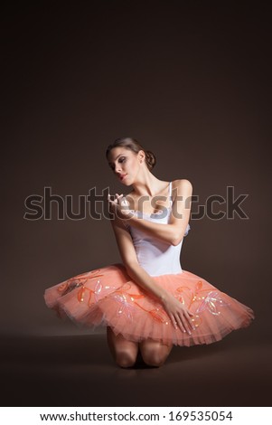 ballerina sitting on the floor