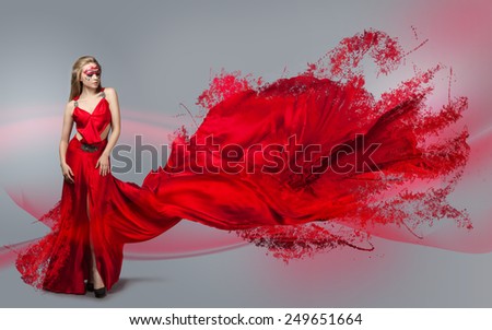 blonde in windy red  dress. Beautiful girl with creative make-up