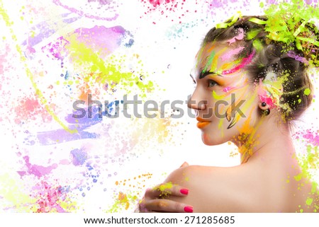 portrait of a girl in the paint. portrait of a girl in the paint. young girl on a light background in spray paint