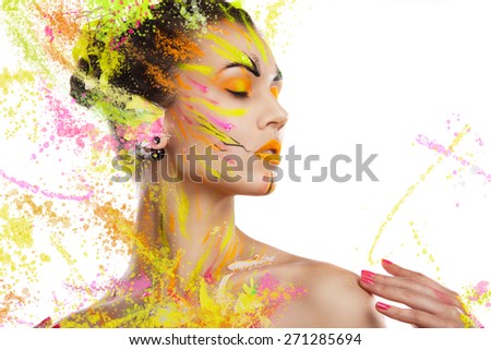 portrait of a girl in the paint. portrait of a girl in the paint. young girl on a light background in spray paint