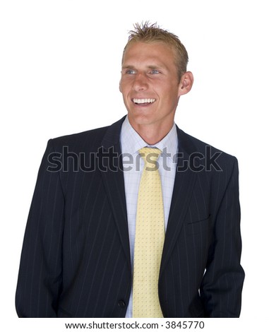 young man dressed in a suit on a clean white background smiling and looking away from the camera