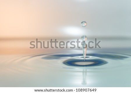 Single water drop on blue and Orange surface