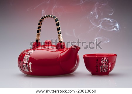 Chinese teapot with steaming cup