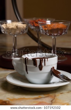 Cookies and coffe cup with chocolate flowing