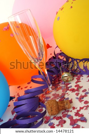 Background party with colorful balloons, glass, confetti and champagne cork
