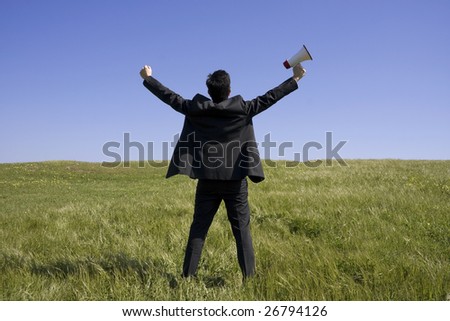Men holding a megaphone Businessman with his arms outstretched on a field with a blue sky