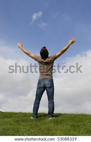 Man with his arms wide open enjoying life