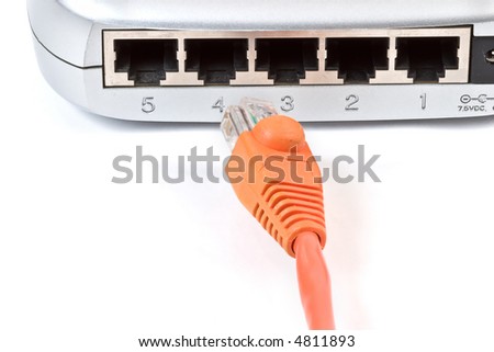 Orange RJ45 CAT5 network cable and 5-port router
