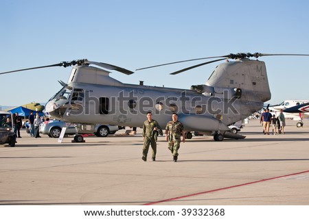 EDWARDS AFB, CA - OCTOBER 17:  Two soldiers walk in front of Boeing Vertol CH-46 Sea Knight helicopter at Flight Test Nation 2009, October 17, 2009, Edwards Air Force Base, CA