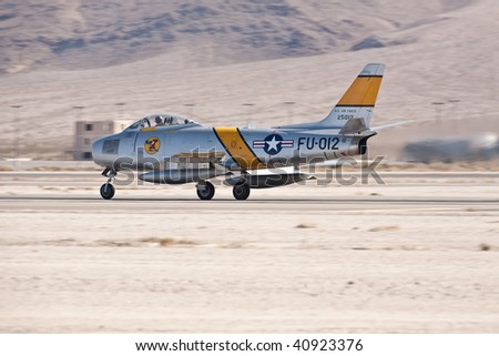 NELLIS AFB, LAS VEGAS, NV - NOVEMBER 14: North American F-86F Sabre Cold war-era fighter jet aircraft lands after performing at Aviation Nation 2009 on November 14, 2009 in Nellis AFB, Las Vegas, NV