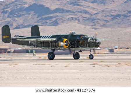 NELLIS AFB, LAS VEGAS, NV - NOVEMBER 14: B-25 Mitchell vintage WWII-era bomber aircraft landing after performing at Aviation Nation 2009 on November 14, 2009 in Nellis AFB, Las Vegas, NV