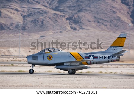 NELLIS AFB, LAS VEGAS, NV - NOVEMBER 14: North American F-86F Sabre Cold war-era fighter jet aircraft takes off at Aviation Nation 2009 on November 14, 2009 in Nellis AFB, Las Vegas, NV.