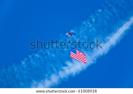 SACRAMENTO, CA - SEPTEMBER 11: Skydiver brings the USA flag down to the show at California Capital Airshow, September 11, 2010, Mather Airport, Sacramento, CA