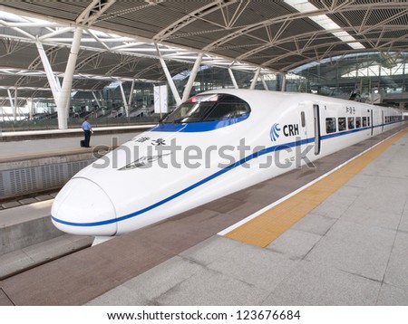 GUANGZHOU, CHINA - JULY 8: Modern train waits at platform on July 8, 2010 in Guangzhou station, Guangzhou, China. China invests in fast and modern railway, trains with speed over 340 km/h.