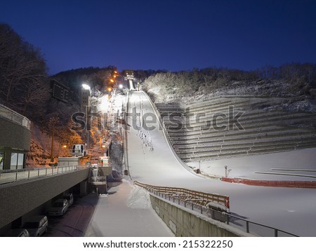 SAPPORO, JAPAN - DEC 12: Okurayama Ski Jump Stadium at night on December 12, 2011 in Sapporo, Japan. This stadium has hosted a number of winter sports events including 1972 Winter Olympics.