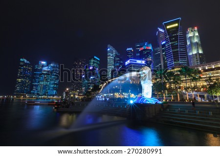 SINGAPORE - OCT 12: The Merlion fountain and Singapore skyline on October 12, 2012. Merlion is an imaginary creature with lion's head and a fish body and is often seen as a symbol of Singapore.