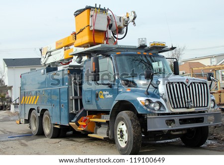 BREEZY POINT, NY - NOVEMBER 15: Canadian electrical company Hydro Quebec truck helping to restore lost power in the aftermath of Hurricane Sandy on November 15, 2012 in Breezy Point, NY