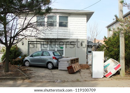 BREEZY POINT, NY - NOVEMBER 15: Damaged car in the aftermath of Hurricane Sandy on November 15, 2012 in Breezy Point, NY
