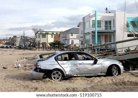 BREEZY POINT, NY - NOVEMBER 15: Destroyed car in the aftermath of Hurricane Sandy on November 15, 2012 in Breezy Point, NY