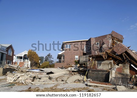 FAR ROCKAWAY, NY - NOVEMBER 11: Destroyed beach houses in the aftermath of Hurricane Sandy on November 11, 2012 in Far Rockaway, NY