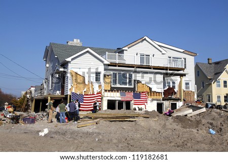 FAR ROCKAWAY, NY - NOVEMBER 11: Volunteers help to rebuild houses in the aftermath of Hurricane Sany on November 11, 2012 in Far Rockaway, NY