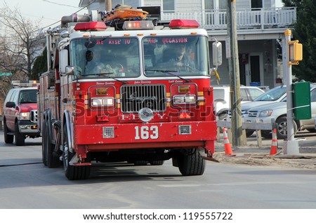 BREEZY POINT, NY - NOVEMBER 20: FDNY firefighters arriving in fire blazed area in the aftermath of Hurricane Sandy on November 20, 2012 in Breezy Point, NY