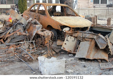 BREEZY POINT, NY - NOVEMBER 20: Burned car in the aftermath of Hurricane Sandy on November 20, 2012 in Breezy Point, NY.
