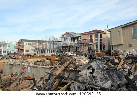 BREEZY POINT, NY - NOVEMBER 20: Burned houses in the aftermath of Hurricane Sandy on November 20, 2012 in Breezy Point, NY. More than 80 houses were destroyed in out-of-control six-alarm blaze.