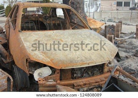 BREEZY POINT, NY - NOVEMBER 20: Burned car in the aftermath of Hurricane Sandy on November 20, 2012 in Breezy Point, NY