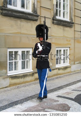 COPENHAGEN, DENMARK - AUGUST 3:Royal Guard guarding Amalienborg Castle on August 3, 2005 in Copenhagen, Denmark. The Royal Guards is a regiment of the Danish Army, founded in 1658 by King Frederik III