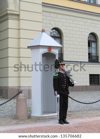 OSLO,NORWAY - AUGUST 12:Royal Guard guarding Royal Palace on August 12, 2005 in Oslo, Norway.His Majesty the King\'s Guard keeps The Royal Palace and the Royal Family guarded for 24 hours a day.