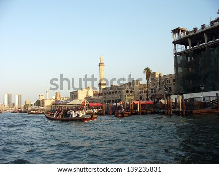 DUBAI, UAE - OCTOBER 26: Abra boats crossing Dubai creek between Bur Dubai and Deira on October 26, 2007. An abra is a traditional boat made of wood; it is used to transport people in Dubai.
