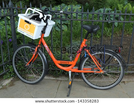 BROOKLYN,NEW YORK - MAY 26: Orange bike in Brooklyn on May 26, 2013. Rolling orange bikes offers sturdy, comfortable Dutch bikes straight from Holland