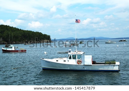 BAR HARBOR, MAINE - JULY 6: Lobster boats at Frenchman Bay near Bar Harbor, Maine on July,6, 2013.  Bar Harbor is a famous summer colony in the Down East region of Maine famous for lobster fishing