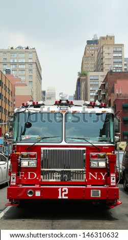 NEW YORK CITY - JUNE 27: FDNY Tower Ladder 12 truck in Manhattan on June 27, 2013.  FDNY is the largest combined Fire and EMS provider in the world