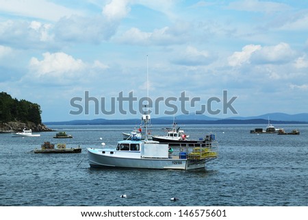 BAR HARBOR, MAINE - JULY 6: Lobster boats at Frenchman Bay near Bar Harbor, Maine on July,6, 2013. Bar Harbor is a famous summer colony in the Down East region of Maine famous for lobster fishing