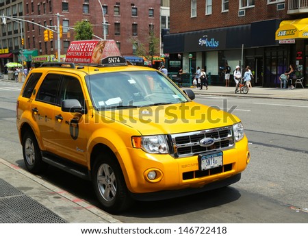 NEW YORK CITY - JUNE 27: New York City Taxi on June 27, 2013. New York City has around 6,000 hybrid taxis, representing almost 45% of the taxis in service.  the most in any city in North America.